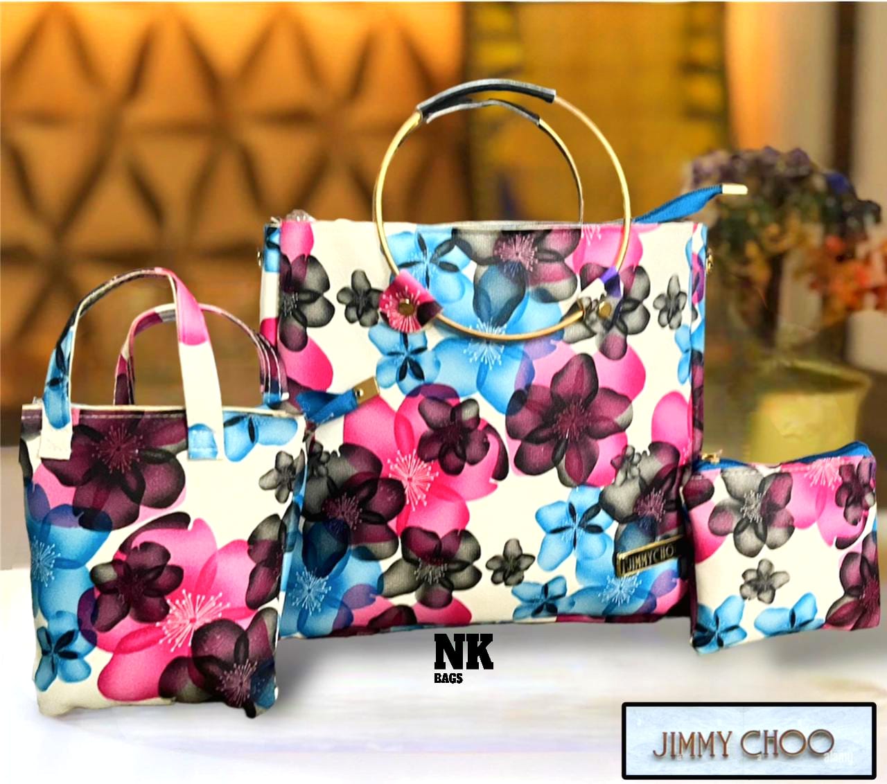 1030D. JIMMY CHOO purse, 3 pc combo, Round steel dual handle, flowery printed. Size